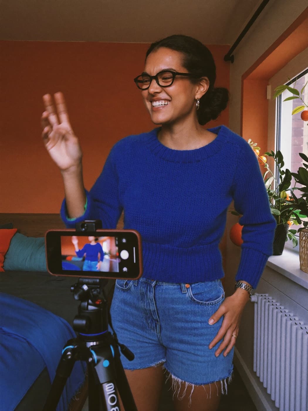 a creator filming a get ready with me in her bedroom