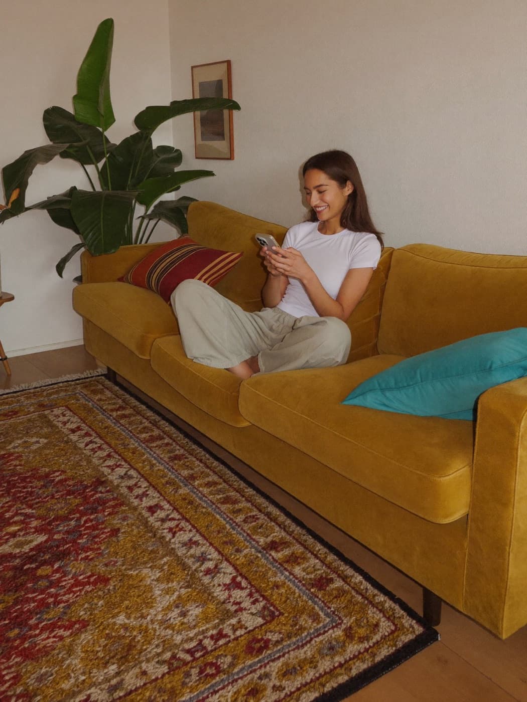 a creator checking a booking on her phone at home